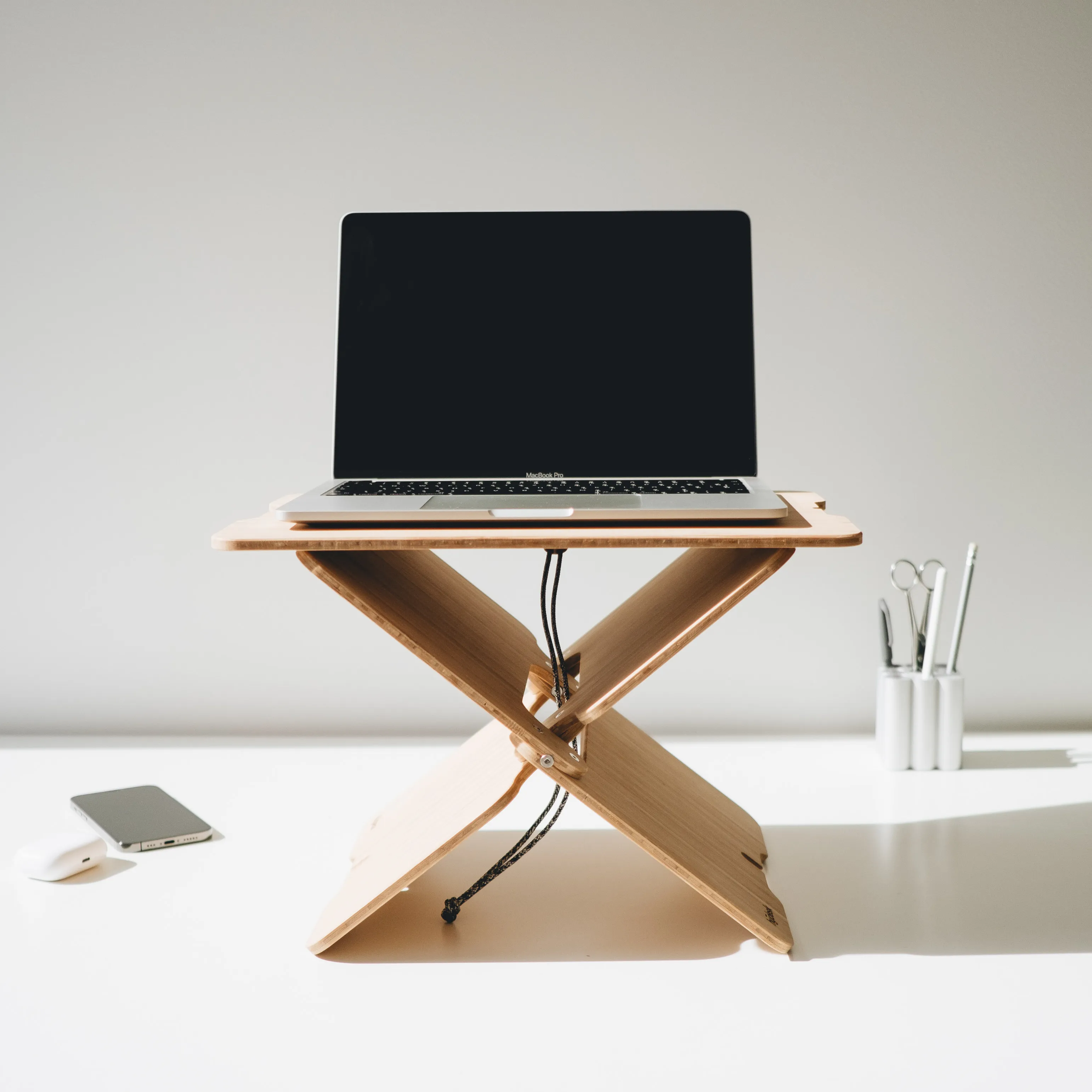 Bamboo hydesk standing desk with a laptop