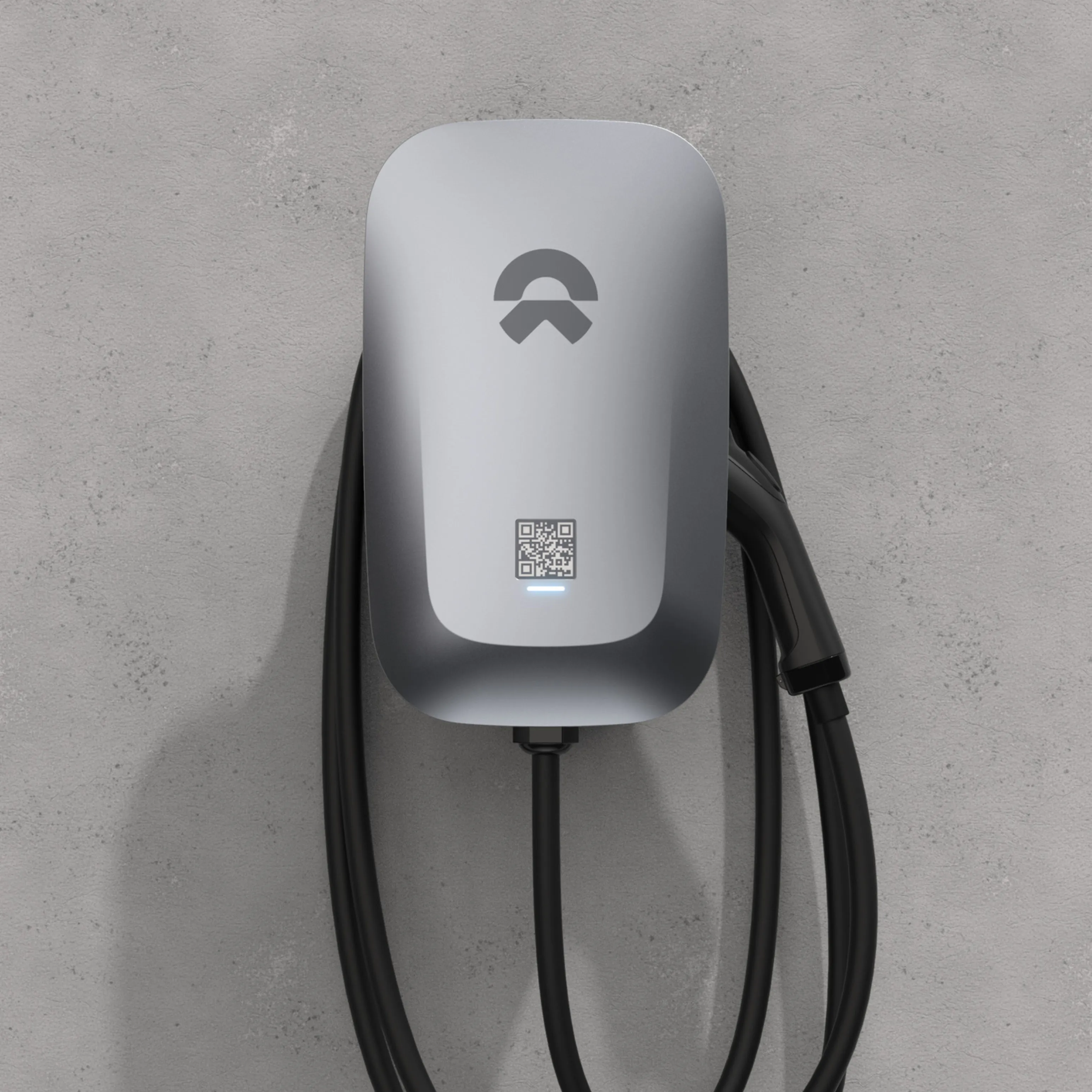 NIO home charger on a concrete wall